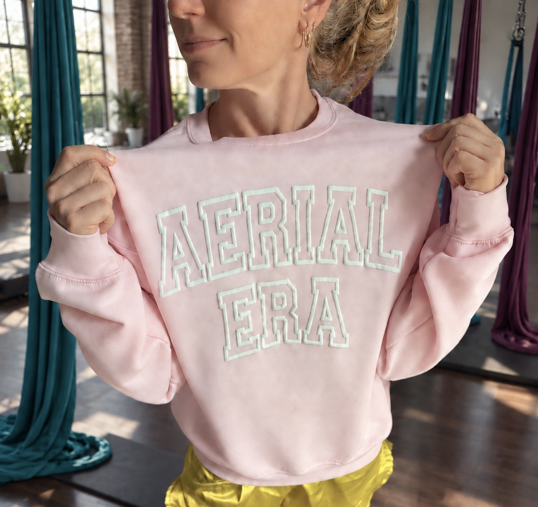 Pink Aerial Era crew sweatshirt with mint lettering